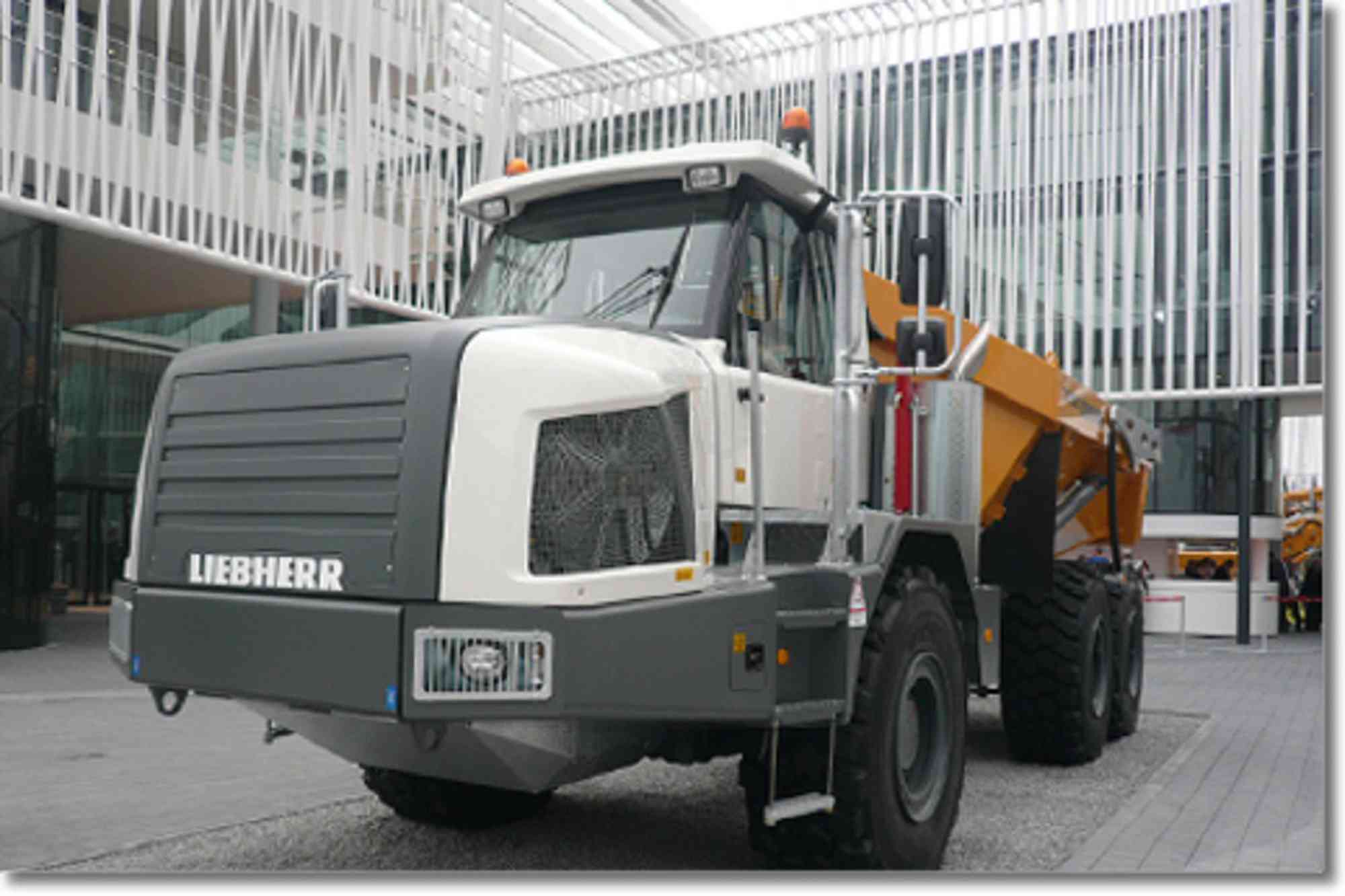 Engine hood for articulated truck